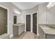 Bathroom with double sinks, neutral walls, and matching cabinets and countertop at 1547 Cambridge Pl, Marietta, GA 30062