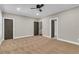 Bedroom with neutral carpet and multiple doors, providing ample access to other areas at 1547 Cambridge Pl, Marietta, GA 30062
