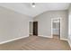 Spacious bedroom features neutral walls, plush carpeting, and an attached bathroom at 1547 Cambridge Pl, Marietta, GA 30062