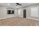 Spacious carpeted bonus room features plantation shutters, ceiling fan, and exterior door at 1547 Cambridge Pl, Marietta, GA 30062
