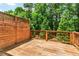 Wooden deck with privacy screen and string lights, ideal for outdoor gatherings at 1547 Cambridge Pl, Marietta, GA 30062