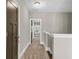 Hallway on the second floor featuring neutral walls and carpet, connecting various rooms at 1547 Cambridge Pl, Marietta, GA 30062