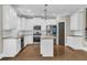 Well-equipped modern kitchen features stainless steel appliances, granite countertops, and a central island at 1547 Cambridge Pl, Marietta, GA 30062