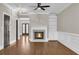 Bright living room features hardwood floors and a marble fireplace with built in shelving at 1547 Cambridge Pl, Marietta, GA 30062