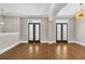 Living room with hardwood floors and French doors at 1547 Cambridge Pl, Marietta, GA 30062