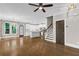 Bright living room boasts hardwood floors, direct access to the kitchen, and a staircase to the upper level at 1547 Cambridge Pl, Marietta, GA 30062
