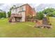 Expansive backyard featuring a deck, patio, and landscaped stone steps, perfect for outdoor relaxation at 1900 Briergate Dr, Duluth, GA 30097