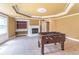 Finished basement offering tile flooring, recessed lighting, and a charming fireplace at 1900 Briergate Dr, Duluth, GA 30097