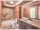 Bathroom with granite countertops, tiled shower and neutral colored walls at 1900 Briergate Dr, Duluth, GA 30097
