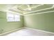 Green bedroom offering a trey ceiling, large window, and abundant natural light at 1900 Briergate Dr, Duluth, GA 30097