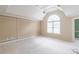 Neutral-toned bedroom with large window, patterned ceiling, and plush carpeting at 1900 Briergate Dr, Duluth, GA 30097