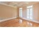 Bedroom with hardwood floors and white shutters at 1900 Briergate Dr, Duluth, GA 30097