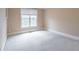 Neutral bedroom with plush carpeting, window with blinds, and ample natural light at 1900 Briergate Dr, Duluth, GA 30097