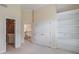 Neutral bedroom features closets, hallway entrance, and built-in shelves at 1900 Briergate Dr, Duluth, GA 30097