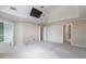 Large bonus room with plush carpeting, ample natural light, and built-in shelves at 1900 Briergate Dr, Duluth, GA 30097