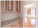Butler's pantry featuring granite countertops and view to the dining room at 1900 Briergate Dr, Duluth, GA 30097