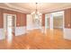 Dining room featuring hardwood floors and view into the foyer at 1900 Briergate Dr, Duluth, GA 30097
