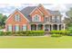 Stately brick home with a manicured lawn and charming curb appeal at 1900 Briergate Dr, Duluth, GA 30097
