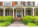 Elegant covered front entrance with white pillars and double doors at 1900 Briergate Dr, Duluth, GA 30097