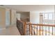 Upstairs hallway with iron railings and a view of the main level's hardwood floors at 1900 Briergate Dr, Duluth, GA 30097