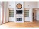 Bright open living room with fireplace, built-in bookshelves and doorway to bath at 1900 Briergate Dr, Duluth, GA 30097