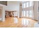 Sun-filled living room with hardwood floors and large windows at 1900 Briergate Dr, Duluth, GA 30097