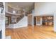 Spacious living room featuring hardwood floors, staircase, and open access to the kitchen at 1900 Briergate Dr, Duluth, GA 30097
