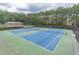 Community tennis courts with professional lighting and viewing area at 1900 Briergate Dr, Duluth, GA 30097