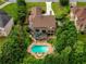 Stunning backyard with a large pool, deck, and lush landscaping at 280 Selkirk Ln, Johns Creek, GA 30097