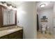 Cozy bathroom with granite countertops, tile flooring, and a toilet in a separate room at 280 Selkirk Ln, Johns Creek, GA 30097