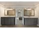Primary bathroom with double vanities and mirrors; bedroom in the background at 280 Selkirk Ln, Johns Creek, GA 30097