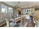 Stylish dining room with built-in bar, large windows, and ample natural light at 280 Selkirk Ln, Johns Creek, GA 30097