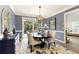 Cozy dining room with modern chandelier, area rug, and access to the deck at 280 Selkirk Ln, Johns Creek, GA 30097