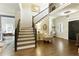 Entryway featuring hardwood floors, staircase, and chandelier lighting at 280 Selkirk Ln, Johns Creek, GA 30097