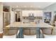 Bright, stylish kitchen features a large island with seating and stainless steel appliances at 280 Selkirk Ln, Johns Creek, GA 30097