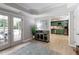 Charming entertaining area with French doors, wet bar, and a view of the green kitchen at 280 Selkirk Ln, Johns Creek, GA 30097