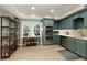 Modern kitchenette with stainless steel appliances, custom cabinets, and sleek countertops, great for entertaining at 280 Selkirk Ln, Johns Creek, GA 30097