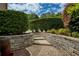 Professionally landscaped yard features terraced stone walls and lush greenery, adding curb appeal at 280 Selkirk Ln, Johns Creek, GA 30097
