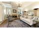 Cozy living room with stone fireplace, built-in bookshelves, and ample natural light at 280 Selkirk Ln, Johns Creek, GA 30097