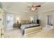 Spacious main bedroom features a trey ceiling, ceiling fan, large windows, and carpet flooring at 280 Selkirk Ln, Johns Creek, GA 30097