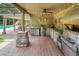 Convenient outdoor kitchen featuring a grill and prep area, is great for entertaining at 280 Selkirk Ln, Johns Creek, GA 30097