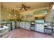 The cozy outdoor kitchen features stainless grill, bar sink, cabinets and granite counters at 280 Selkirk Ln, Johns Creek, GA 30097