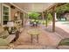 Spacious covered patio with comfortable seating and dining area offers a relaxing outdoor retreat at 280 Selkirk Ln, Johns Creek, GA 30097