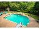 Inviting pool with a slide and spa, surrounded by lush landscaping at 280 Selkirk Ln, Johns Creek, GA 30097
