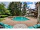 Backyard showcasing a private pool, hot tub, and patio seating for outdoor relaxation at 280 Selkirk Ln, Johns Creek, GA 30097
