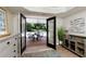 Inviting covered patio perfect for relaxation by the pool, enhanced by French doors for seamless indoor/outdoor flow at 280 Selkirk Ln, Johns Creek, GA 30097