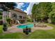 Resort-style backyard with a swimming pool, hot tub and a fun water slide at 280 Selkirk Ln, Johns Creek, GA 30097