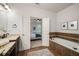 A lovely ensuite bathroom with a soaking tub, vanity, and adjoining bedroom at 3331 Vintage Se Cir, Smyrna, GA 30080