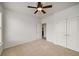 A bright bedroom shows neutral carpet, white walls, and double door closet at 3331 Vintage Se Cir, Smyrna, GA 30080