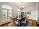 Elegant dining room with hardwood floors, wainscoting, and a chandelier at 3331 Vintage Se Cir, Smyrna, GA 30080